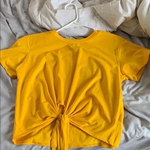 Yellow crop top with front tie on the bottom